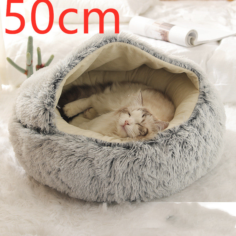 Cat sleeping in round gray plush pet bed, 50cm size, providing warmth and comfort for winter.