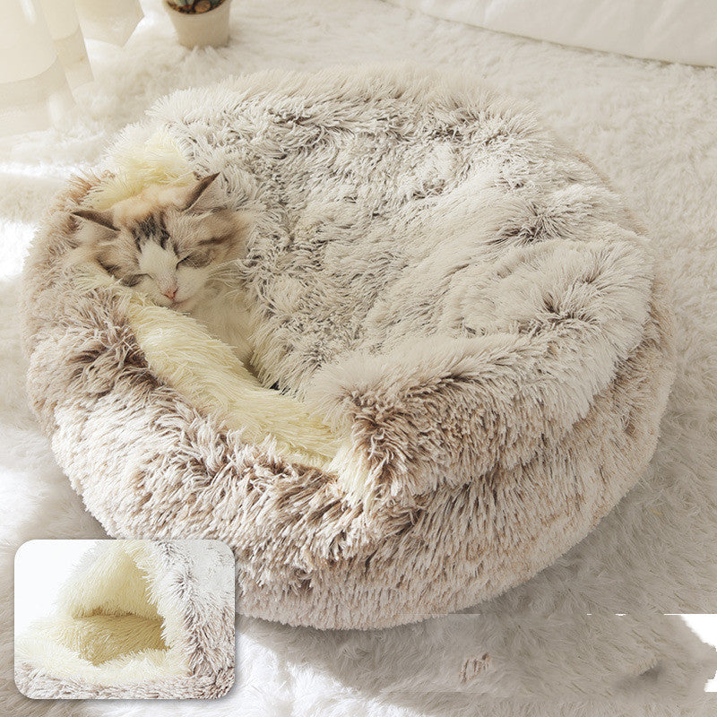 Cat sleeping in plush round pet winter bed with cozy warm design