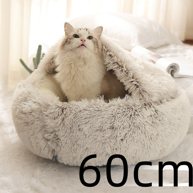 Cat sitting in a 60cm round plush pet bed for cats and dogs, providing warmth and comfort in winter